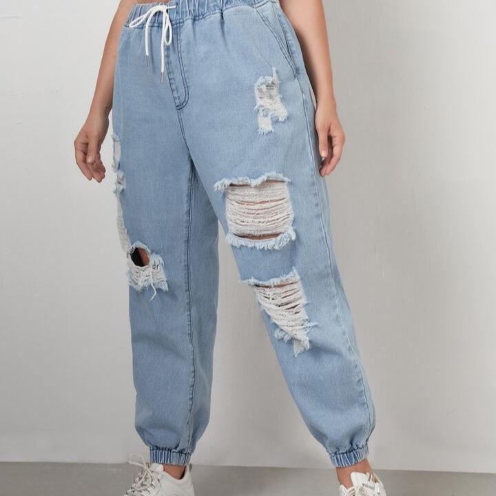 Light blue ripped jeans with elastic waist and drawstring featuring a baggy fit #Rippedjeans 4