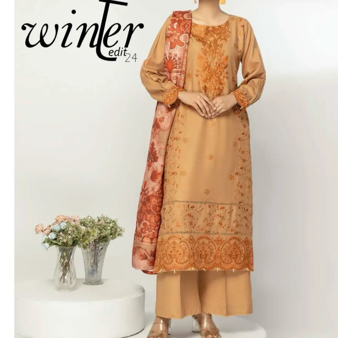 Brown Alipne winters collection with embroidered and digital woollen shawls .