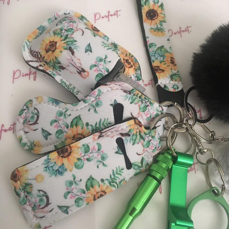 Pinky Perfect UK Legal Green Sunflower Key Chain Set with 3-in-1 Stylus, Door Opener, Bottle Opener, Whistle, Personal Alarm, Light, Wristlet, Sanitiser Pouch, Bottle, Lip Balm Holder, Pom Pom and Car Escape Tool 1