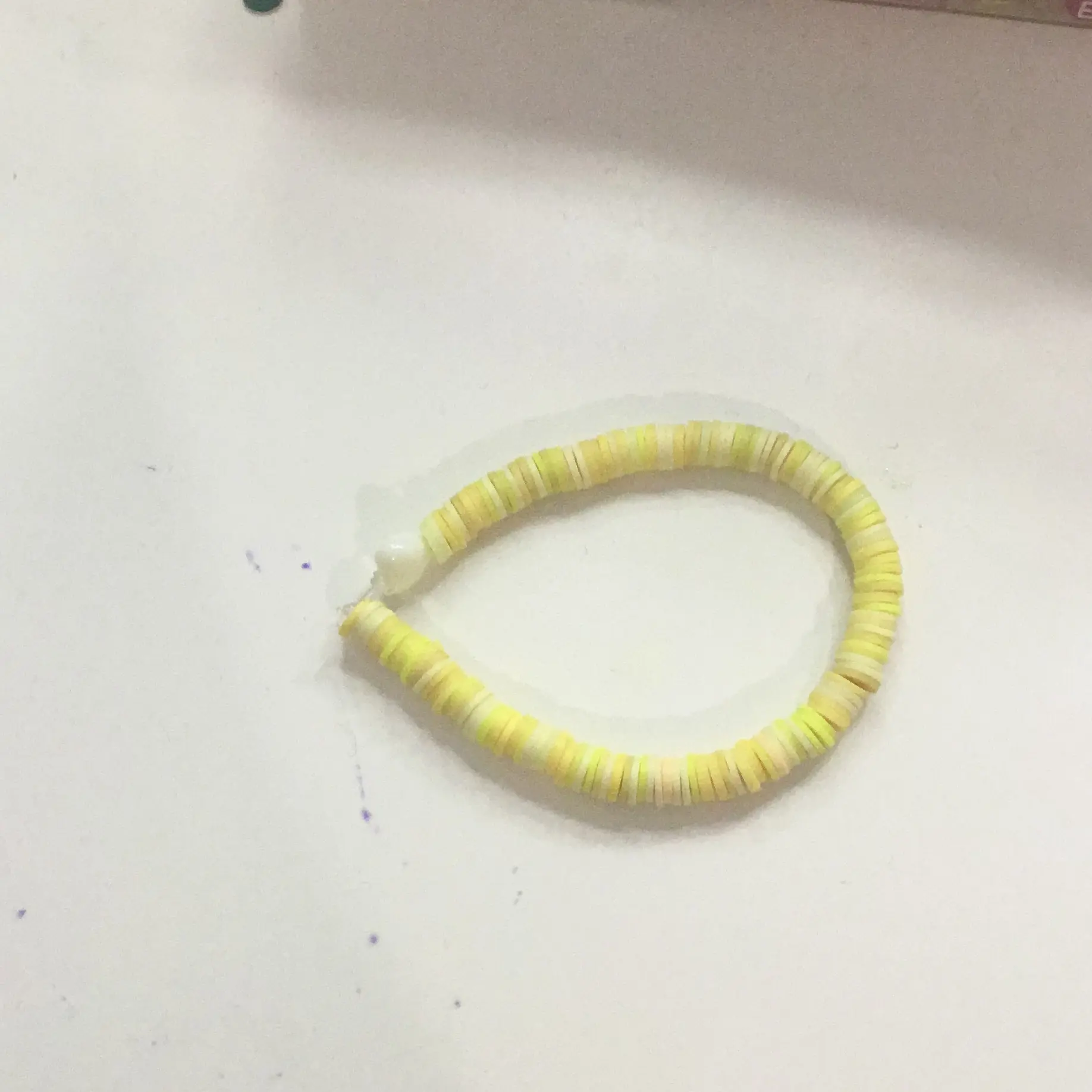 Yellow bracelet with pastel heart