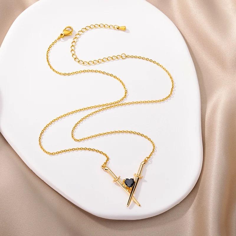 Sword With Black Crystal Heart Necklace In Gold Or Silver Finish, Crossed Over Sword With Heart Design Necklace, Gift Necklace For Her 5