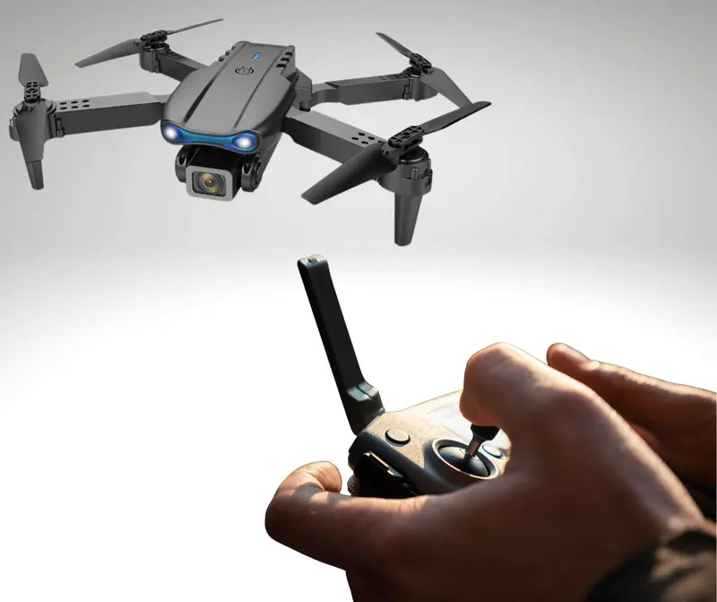 "Trendi E99 Foldable Quadcopter Drone with 360° Roll and Dual HD Lenses - Includes Cameras, Accessories, and Folding Charging Crystal Drones." 5