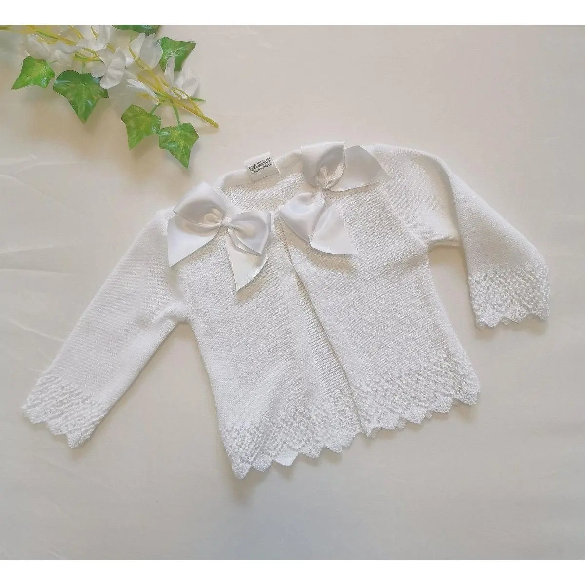 Bow        white cardigan
