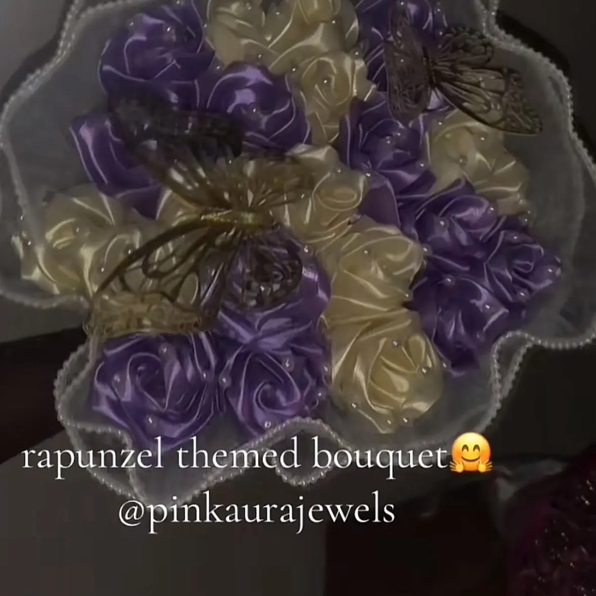20 count purple and white rapunzel themed bouquet with pearls and white mesh wrapping and 2 butterflies
