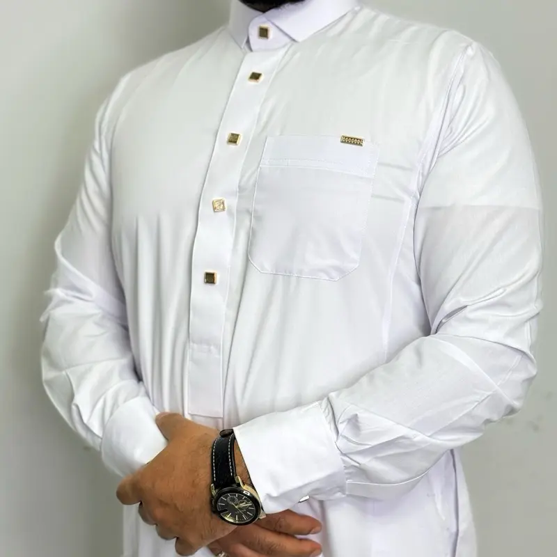 White Saudi Premium Thobe for Men - Indulgent Fabric, Breast Pocket & Two Side Pockets with yellow metal buttons. luxury