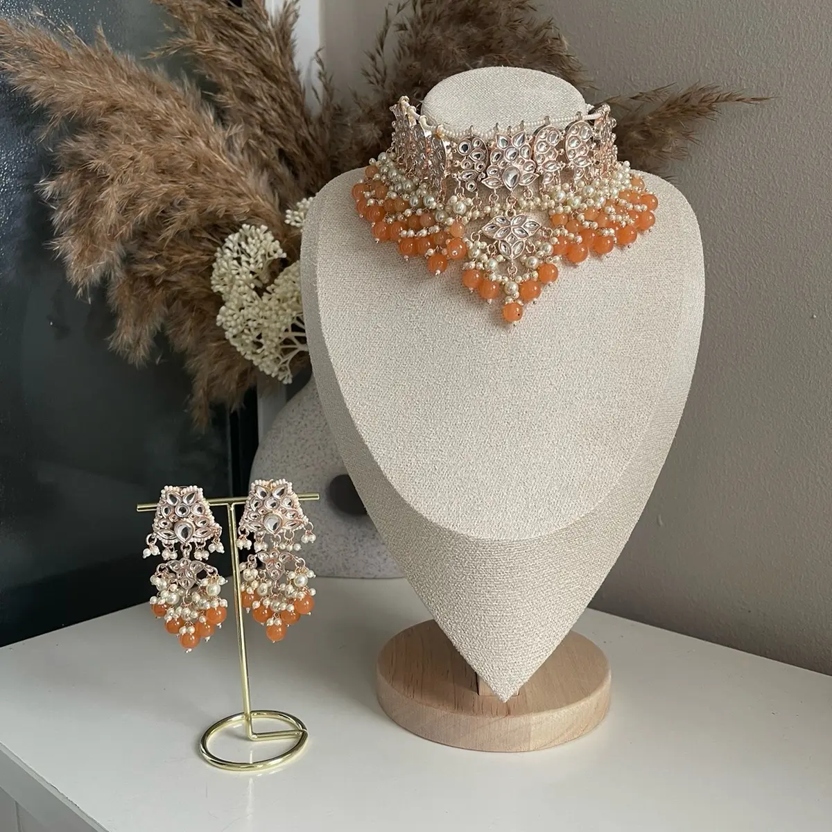 Indian jewellery set including necklace and earrinearrings in rose gold and various colours