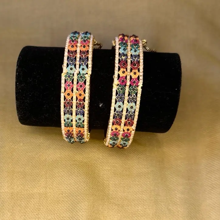 Golden Colorful design Bracelet / karraah . 2 piece set of elegant and beautiful hand jewellery . Perfect for wedding/ Engagement & Party . Adjustable karraah. Adjustable chain Bracelet. Standard size . Size 2.4/ 2.5 bracelet with ring (adjustable)2.5size
