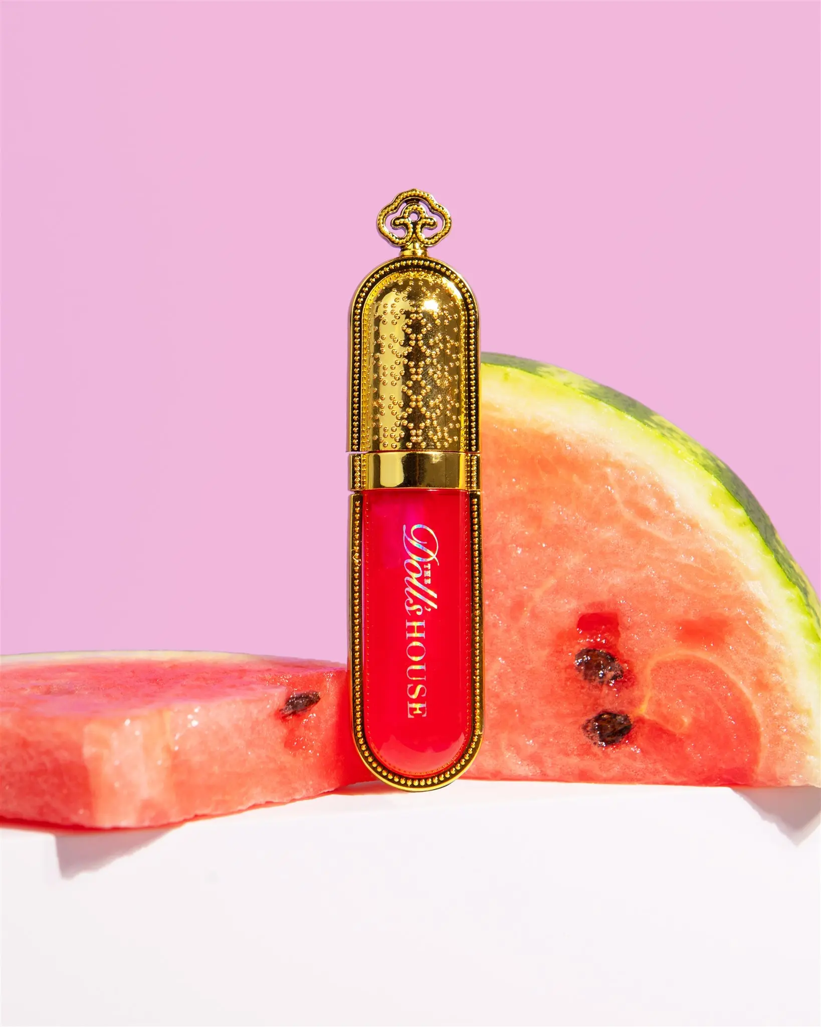 The Dolls House Cosmetics Lip R’Oil’ty – nourishing, high-shine lip oil enriched with jojoba oil for soft, hydrated lips.