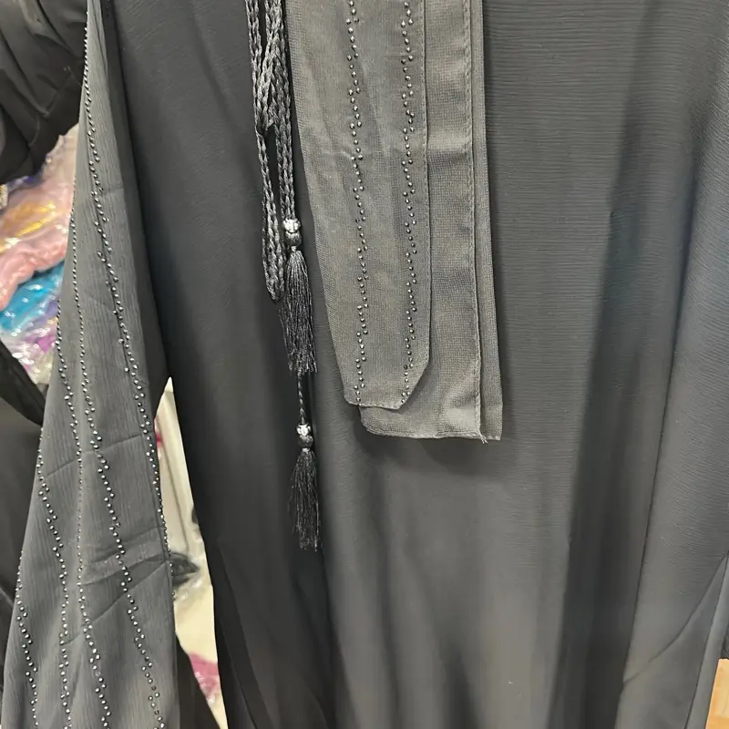 black closed abaya with design on the arms