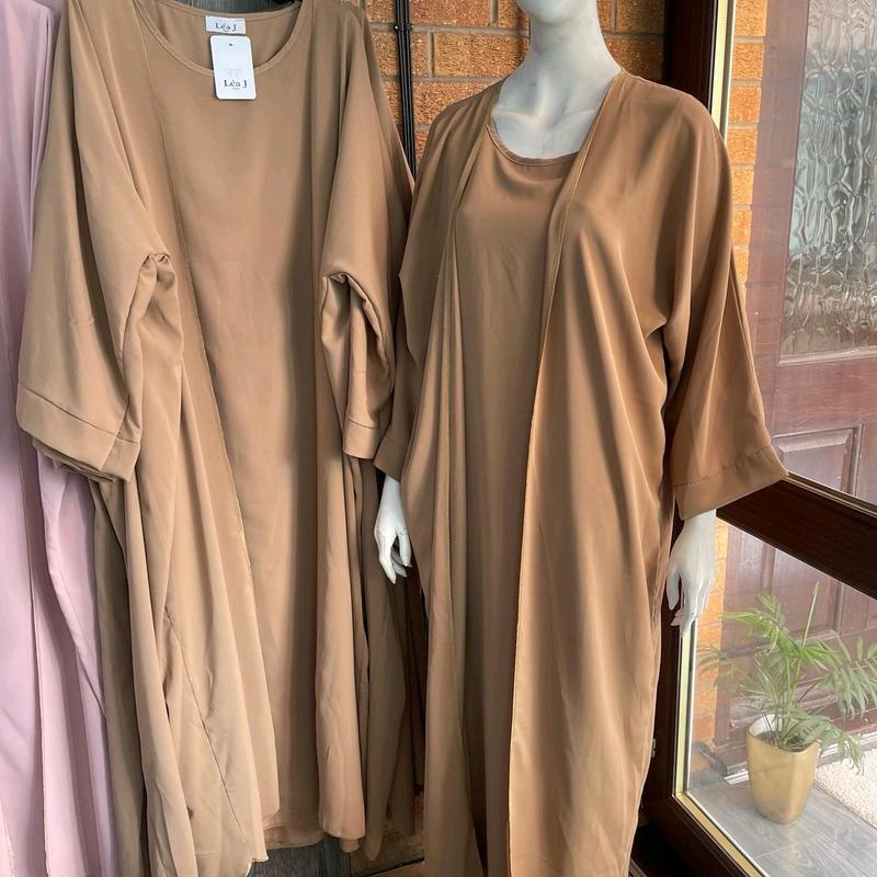 abaya Fancy modeswear arabian style abaya for muslim modestwear .2 pcs beautiful inner outer bagy batween style gown with gold finishing detail.made in france beautiful material . 4