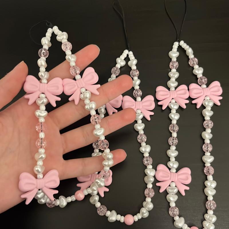 Pink crystal + bow phone charm 0