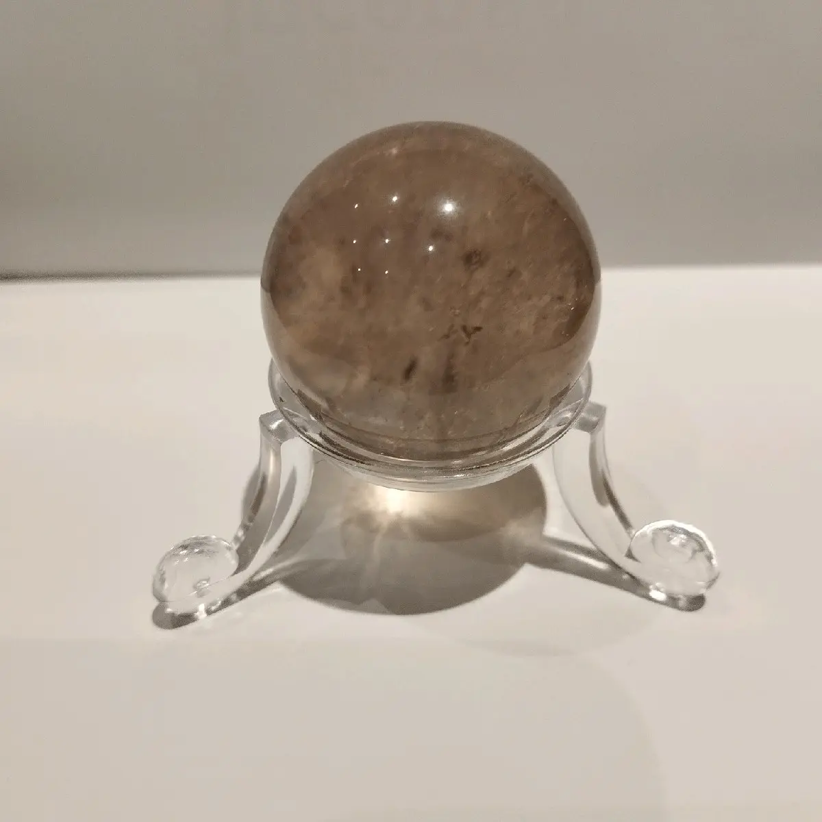 smokey quartz sphere with free stand