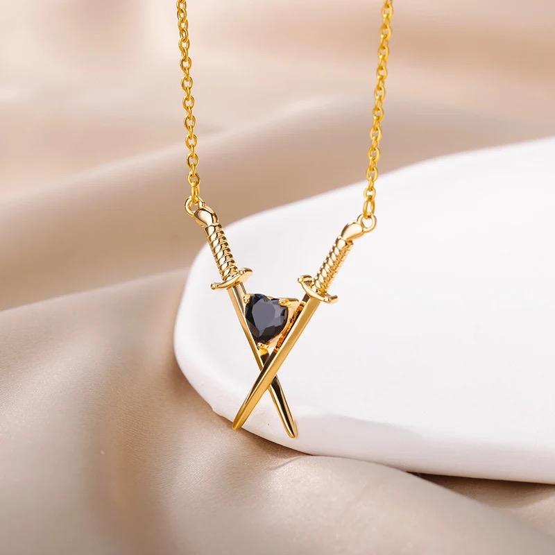 Sword With Black Crystal Heart Necklace In Gold Or Silver Finish, Crossed Over Sword With Heart Design Necklace, Gift Necklace For Her 2