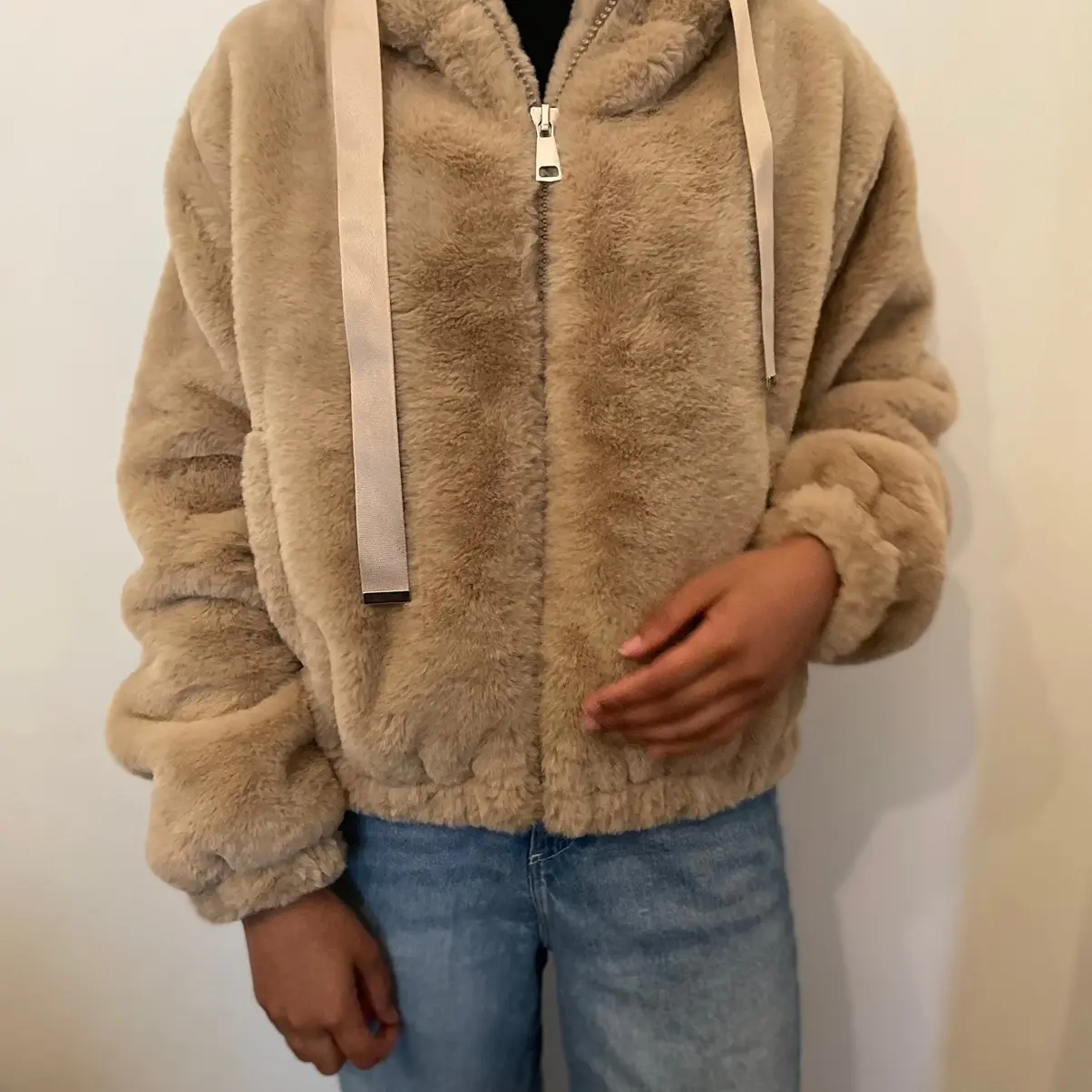 Women’s bomber faux fur hooded jacket in brown, beige and white.
