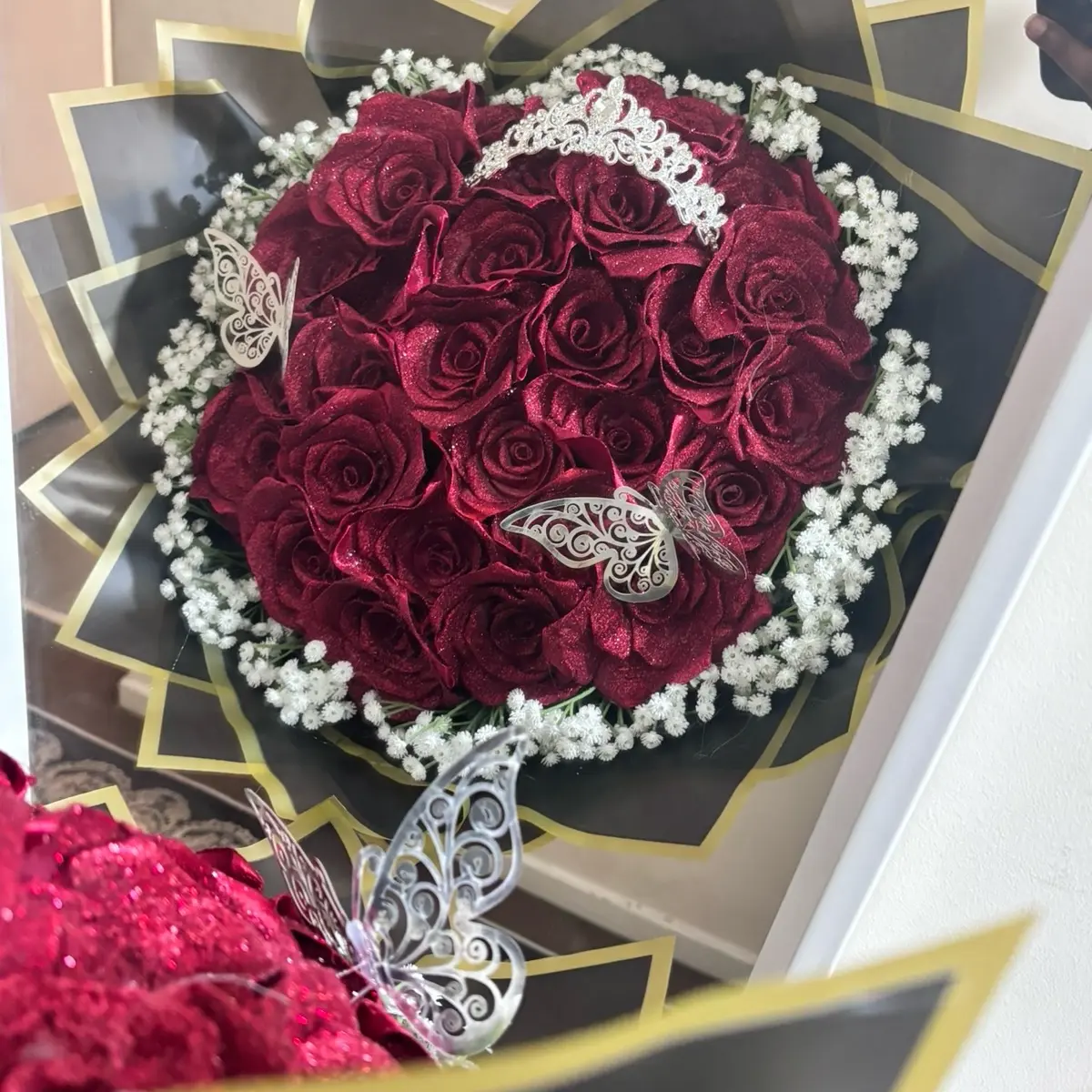 30 ct red glitter roses with baby’s breath rim crown & 2 butterflies ( crown & butterflies come in either gold or silver)