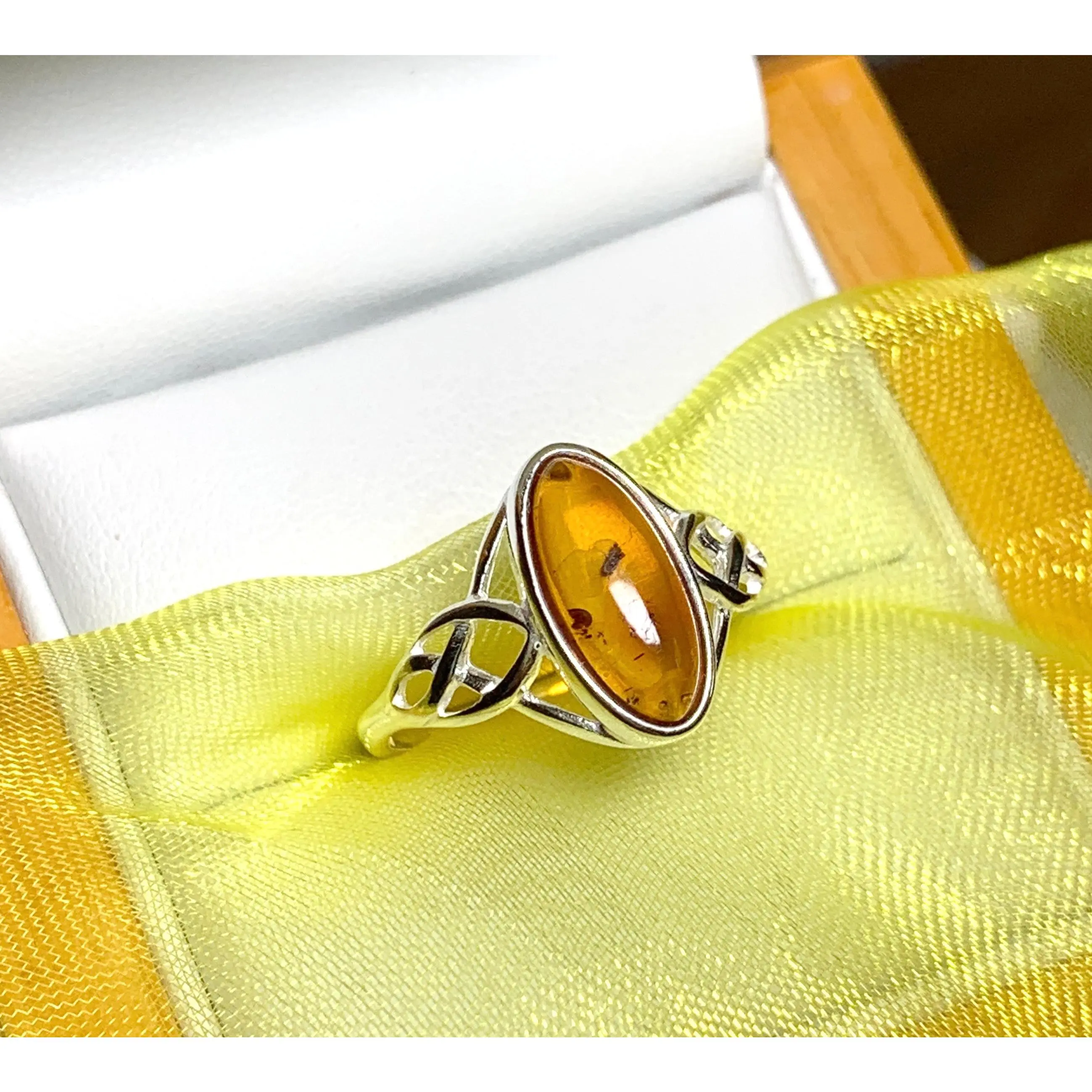 Real amber ring oval shaped Celtic designed shoulders