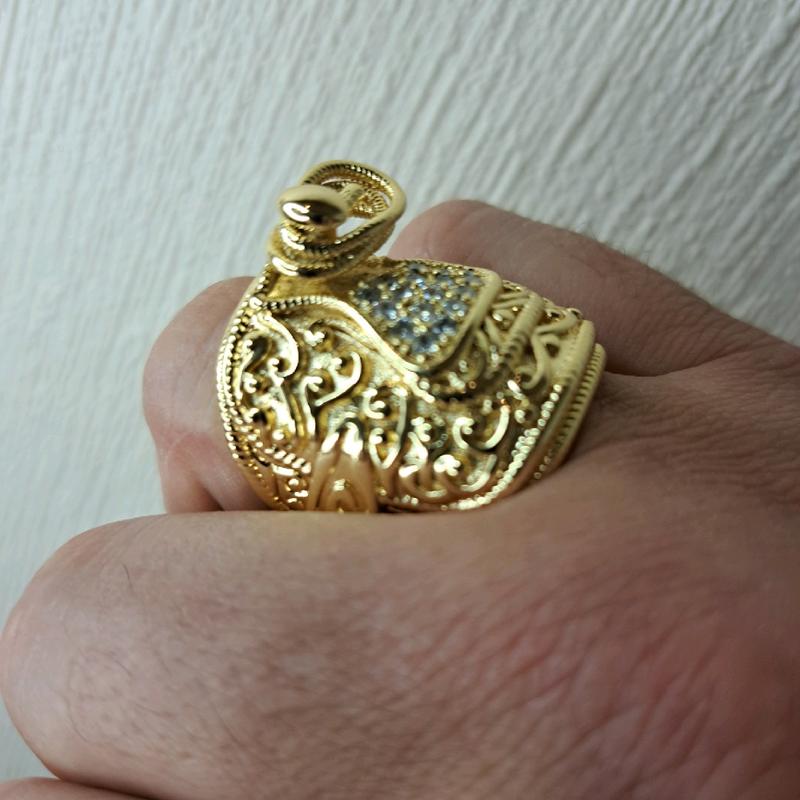large saddle ring adjustable for size. gold plated stainless Steel. 1