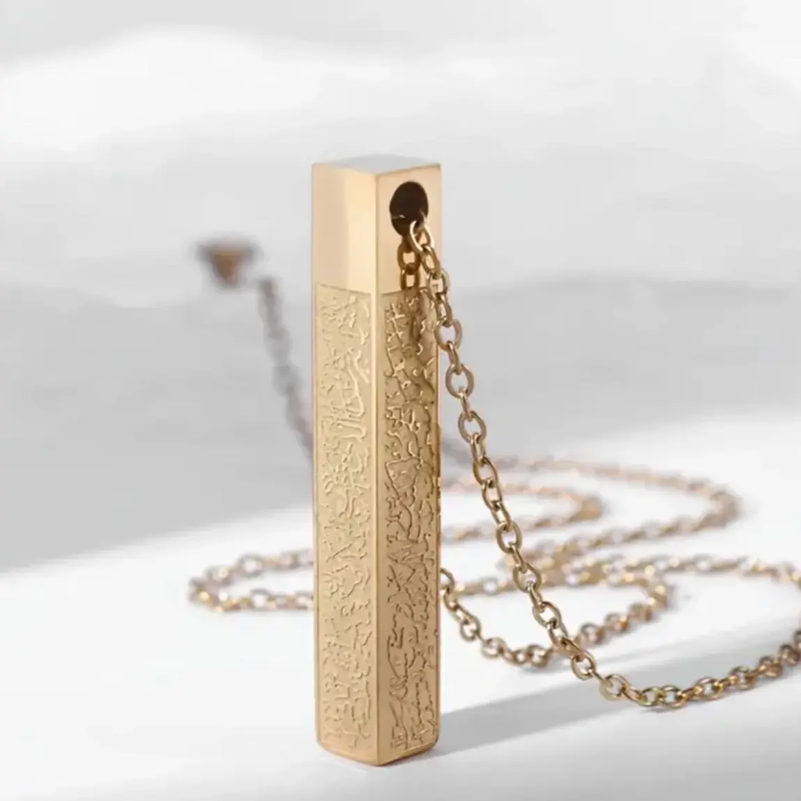 A Stainless Steel Ayatul Kursi Islamic Muslim Cube Pendant Necklace in gold For Men And Women, With Arabic Calligraphy Jewelry, Perfect Gift For Your Loved Ones