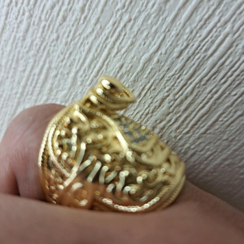 large saddle ring adjustable for size. gold plated stainless Steel. 2