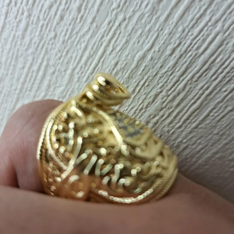 large saddle ring adjustable for size. gold plated stainless Steel. 2