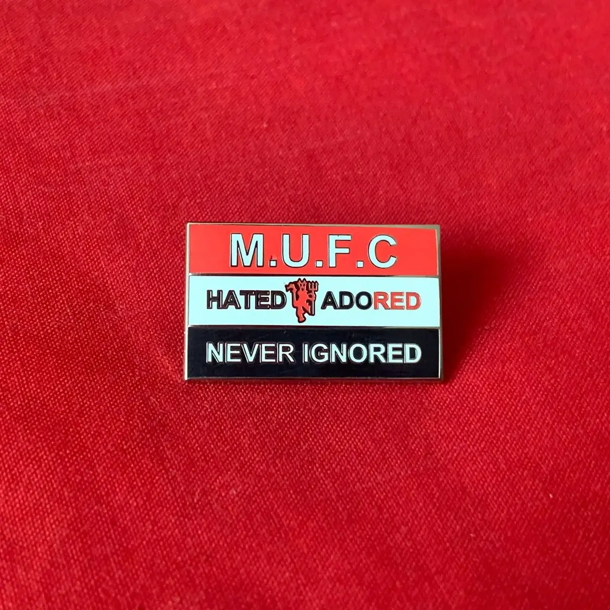 MUFC, Hated, Adored, Never Ignored Pin Badge