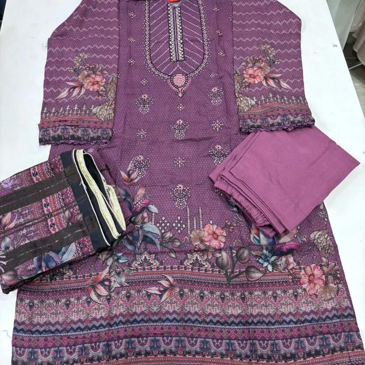 Purple casual readymade suits .