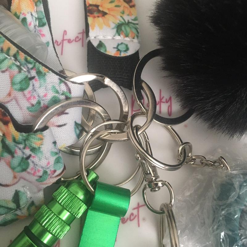 Pinky Perfect UK Legal Green Sunflower Key Chain Set with 3-in-1 Stylus, Door Opener, Bottle Opener, Whistle, Personal Alarm, Light, Wristlet, Sanitiser Pouch, Bottle, Lip Balm Holder, Pom Pom and Car Escape Tool 8