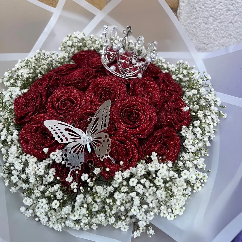 Red glitter roses wrapped in white bouquet paper. Fresh roses, gift, birthday, Valentine day, present Flower flowerbouquets Decor Decorative