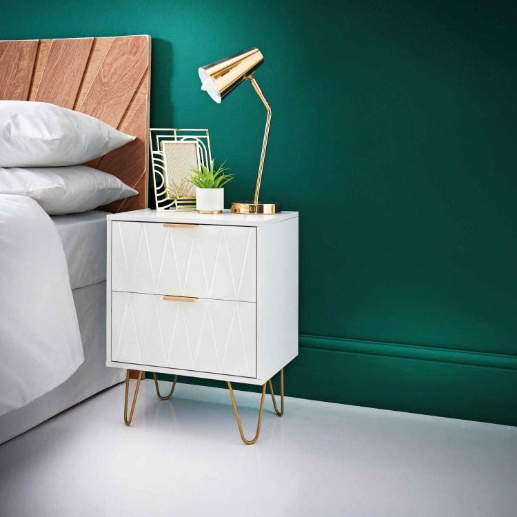 Loft Studio 2 Drawer Bedside Table Add a stylish piece of furniture to your bedroom with this Loft Studio 2 Drawer Bedside Table Embossed drawers featuring gold finish metal legs.- White 0