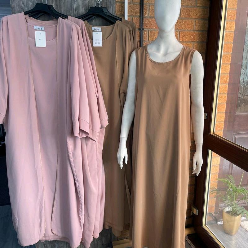 abaya Fancy modeswear arabian style abaya for muslim modestwear .2 pcs beautiful inner outer bagy batween style gown with gold finishing detail.made in france beautiful material . 1