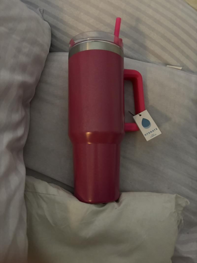 Product Introduction of 40oz tumbler, 1200ml capacity, stainless steel, glitzy pink outer colouring, lockable lid and straw holder, comes with straw, has handle. Brilliant for at home me or days out. Suitable for hot and colds drinks.  Drinkware. 3