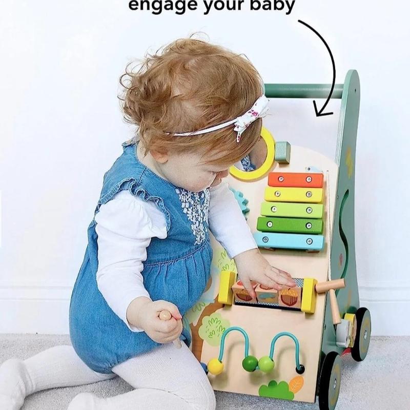 Nuby Wooden Walker, This toy is great for encouraging hand-eye development. The round rotating mirror teaches your baby their reflection. This multi-activity wooden walker comes with a handy storage pouch underneath so your little one can store other toys 6