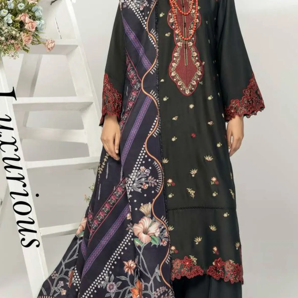 Black Alipne winters collection with embroidered and digital woollen shawls .