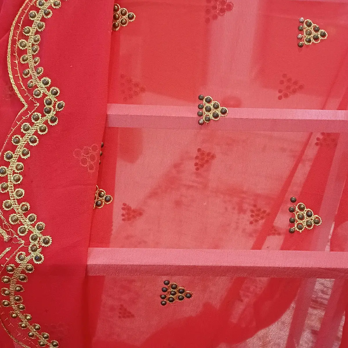 gabsar with gold beads and red colour. it fits any occasions. chiffon